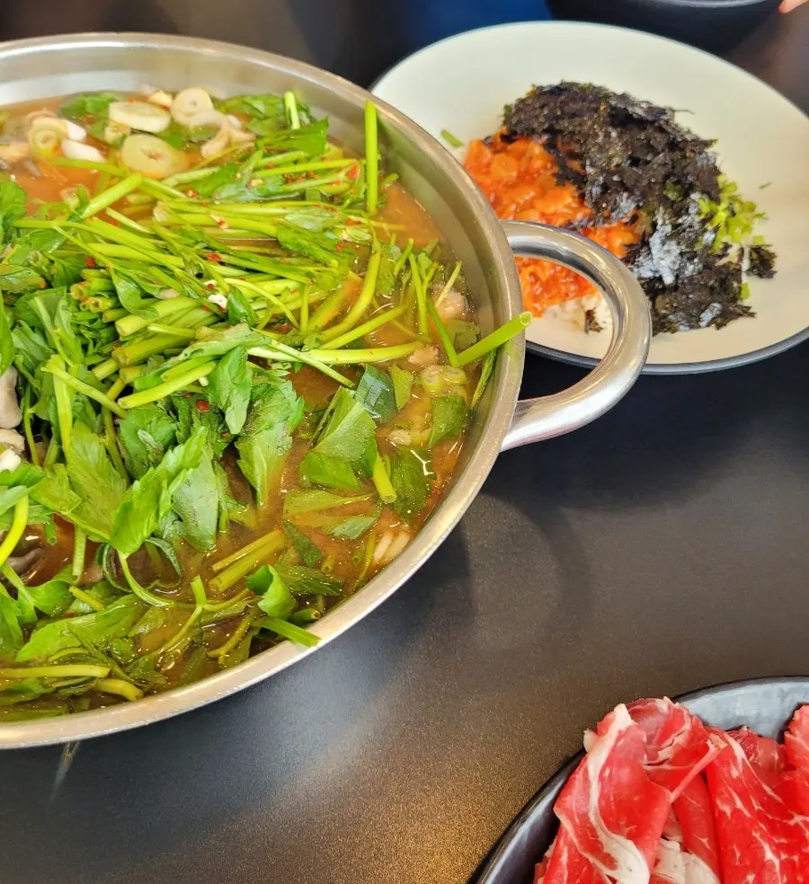 Thin shabu-shabu meat dipped in the broth