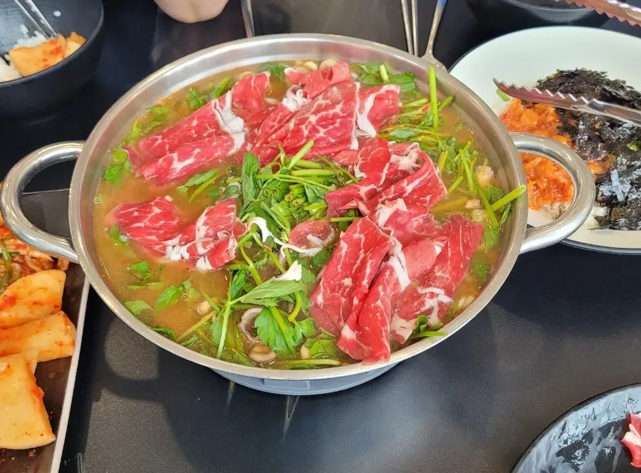 Plate of cooked meat and vegetables together