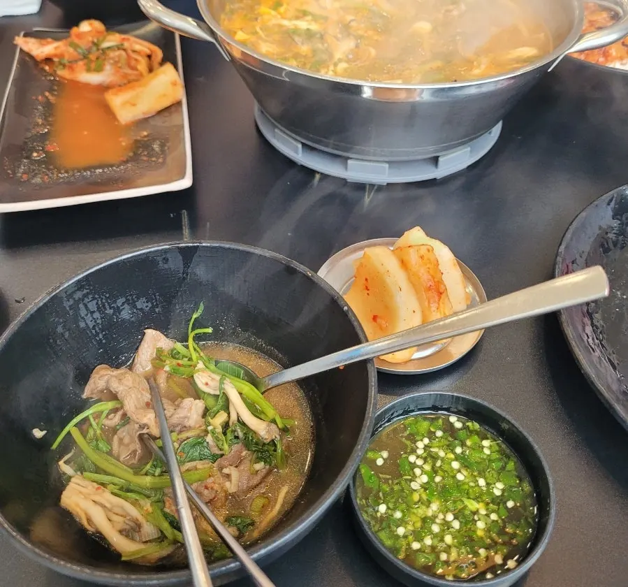 Group sitting around the shabu-shabu pot