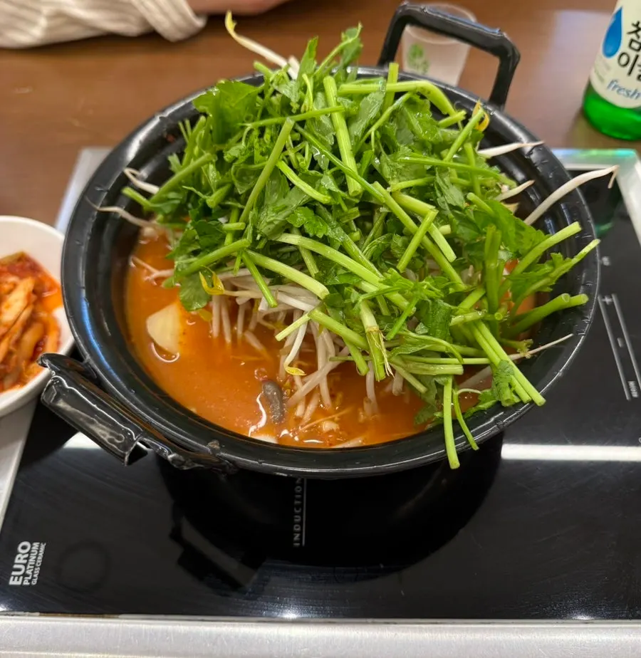 Table setup with spicy mushroom kalguksu for two and shabu beef