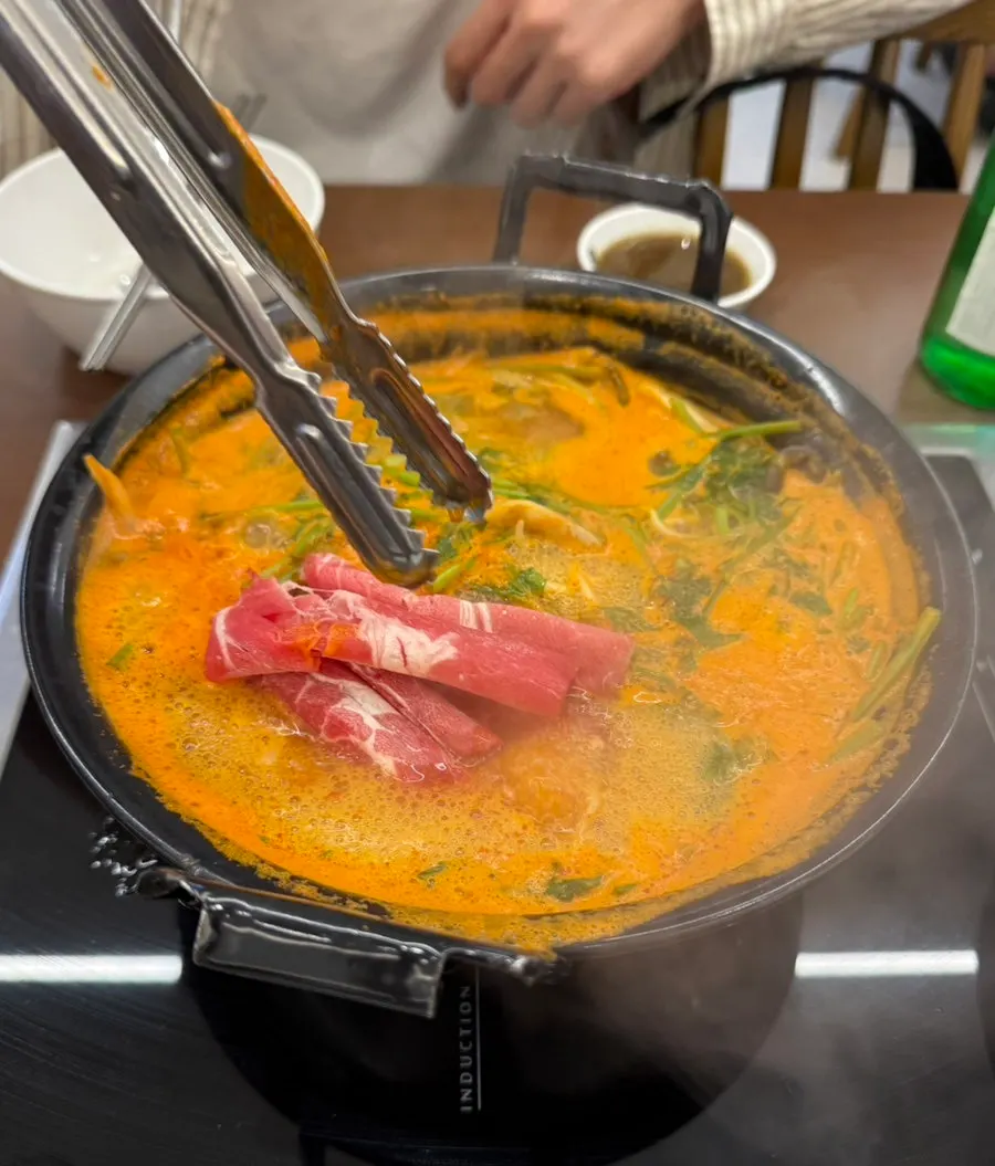 Shabu beef added into the boiling broth