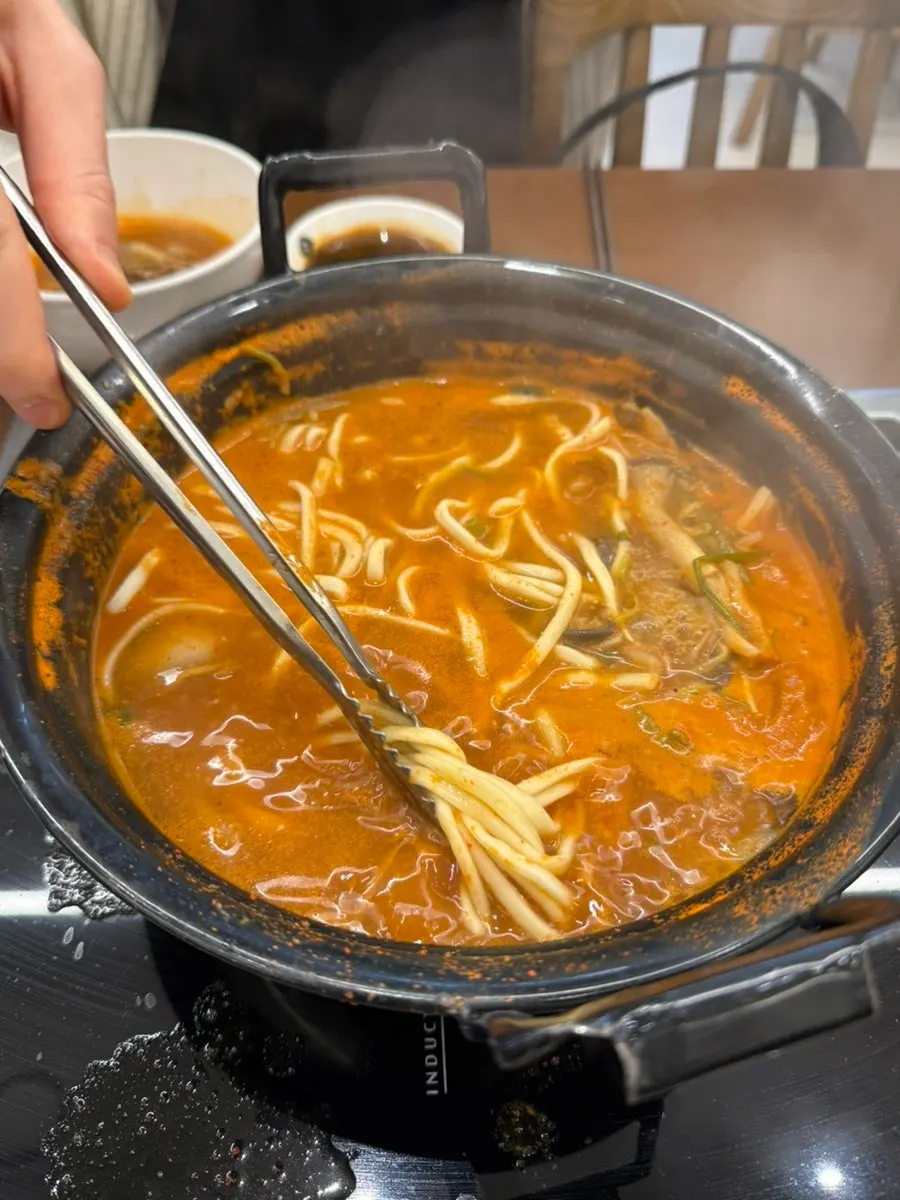 Leftover spicy broth after eating the solid ingredients