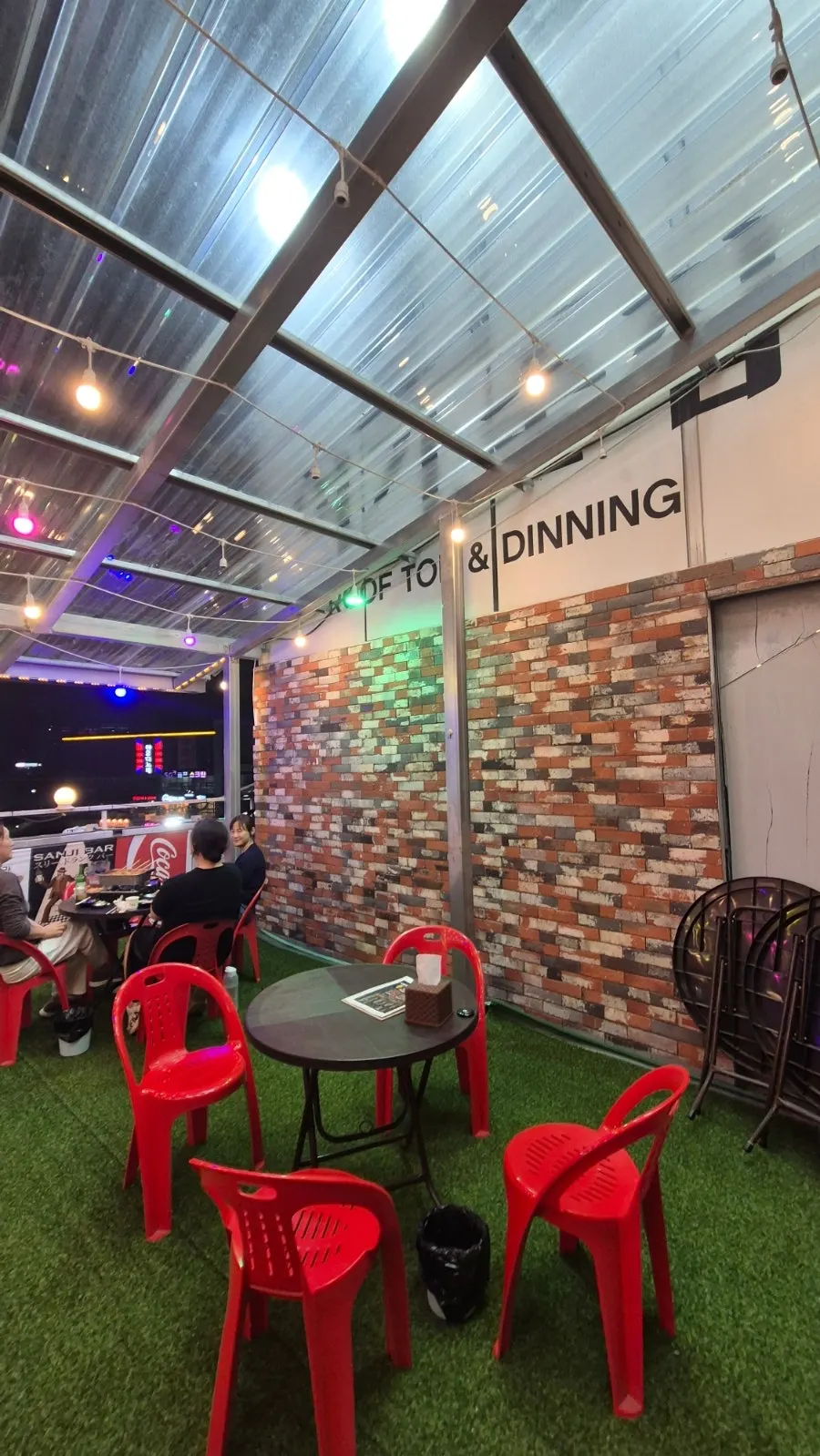 Outdoor night terrace seating at Eomuk Pocha Tong
