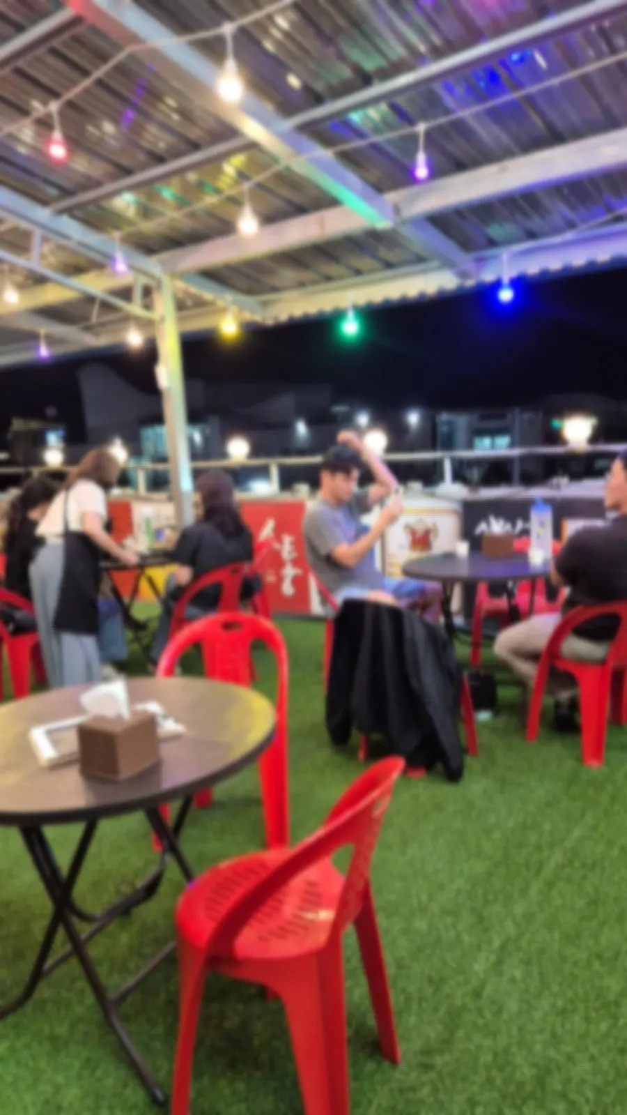 Guests seated in the outdoor night terrace area