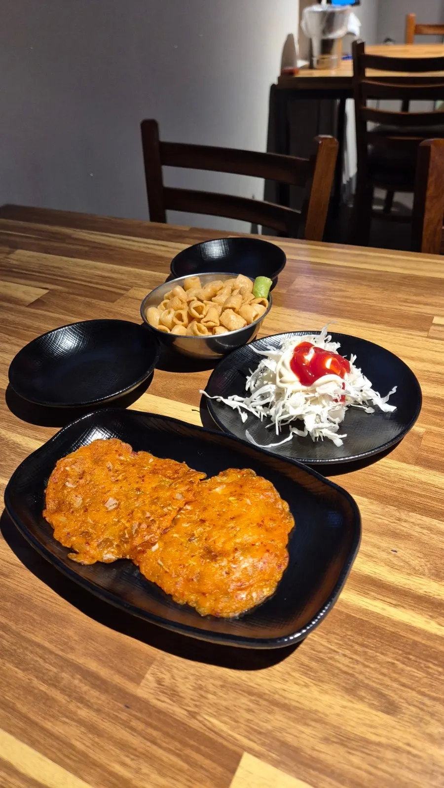 Kimchi pancake, snacks, and salad as basic sides