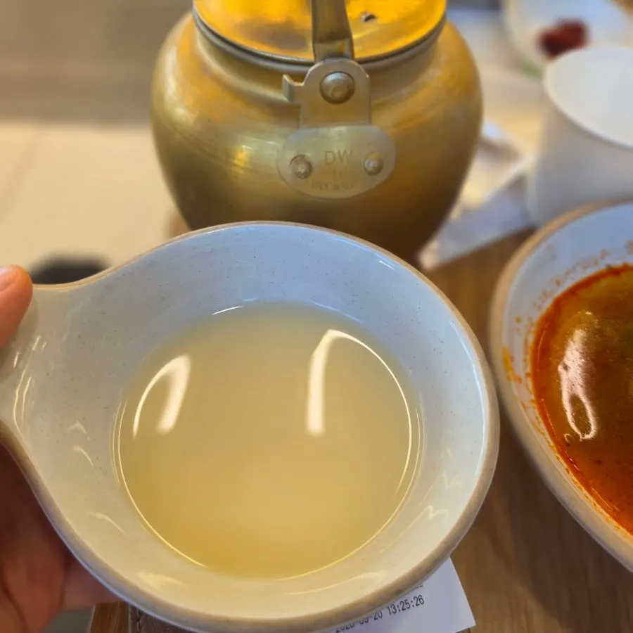 A cup of makgeolli poured from the self-bar