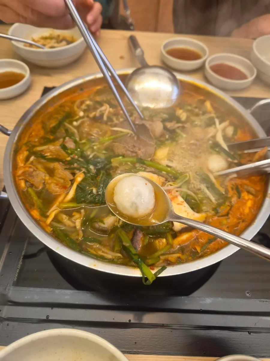 A bite of shabu-shabu dipped in sauce