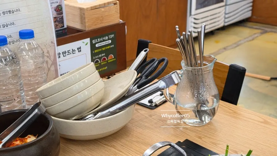 Spoon and chopsticks soaking in warm water