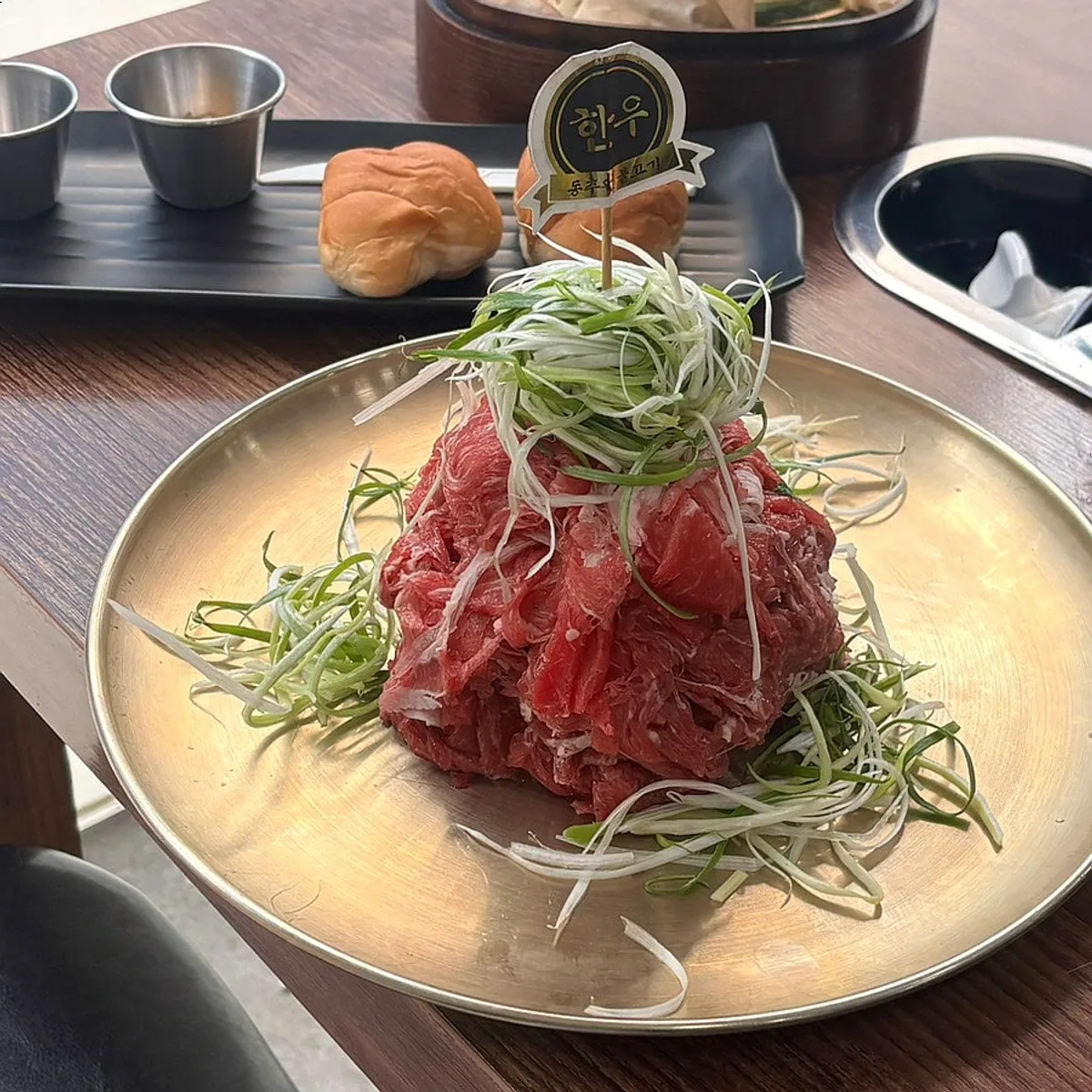 Signature spread photo of Dongchuwon Bulgogi's Korean beef bulgogi table setting