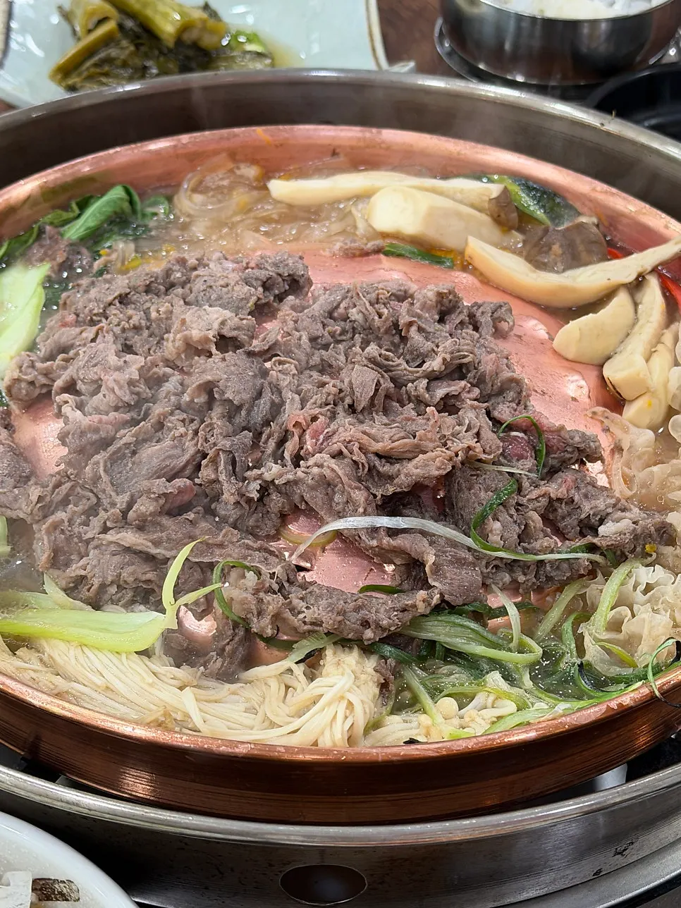 Vegetables and glass noodles simmered in the broth