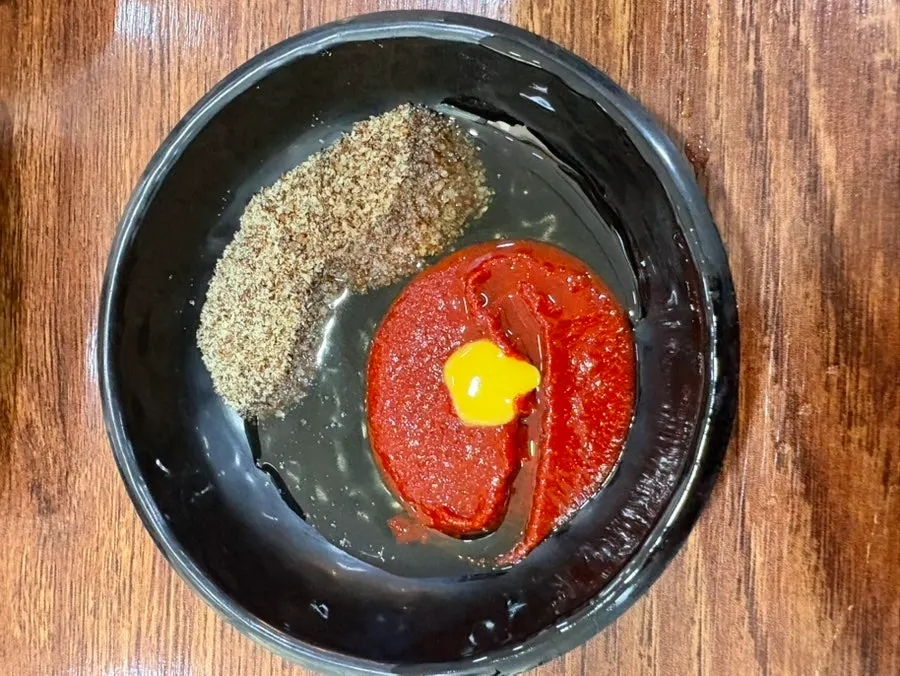 A dish of dipping sauce for the meat