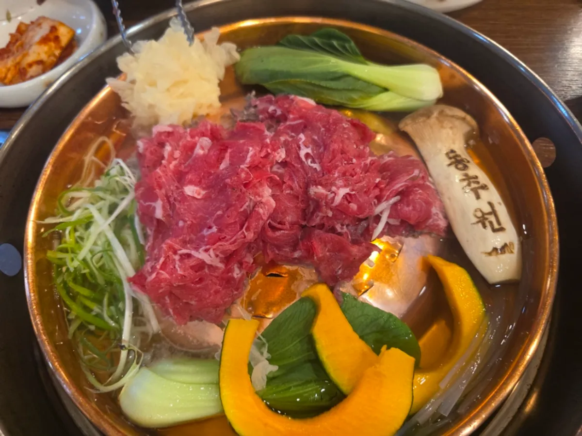 Table spread of Korean beef bulgogi at Dongchuwon Bulgogi in Hagik-dong, Incheon