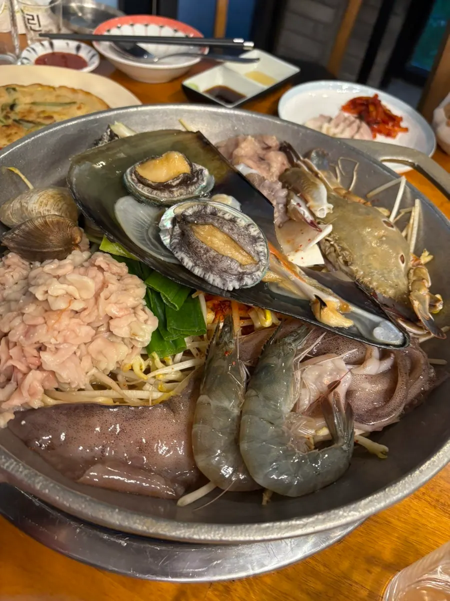 Pot of seafood stew packed with seafood