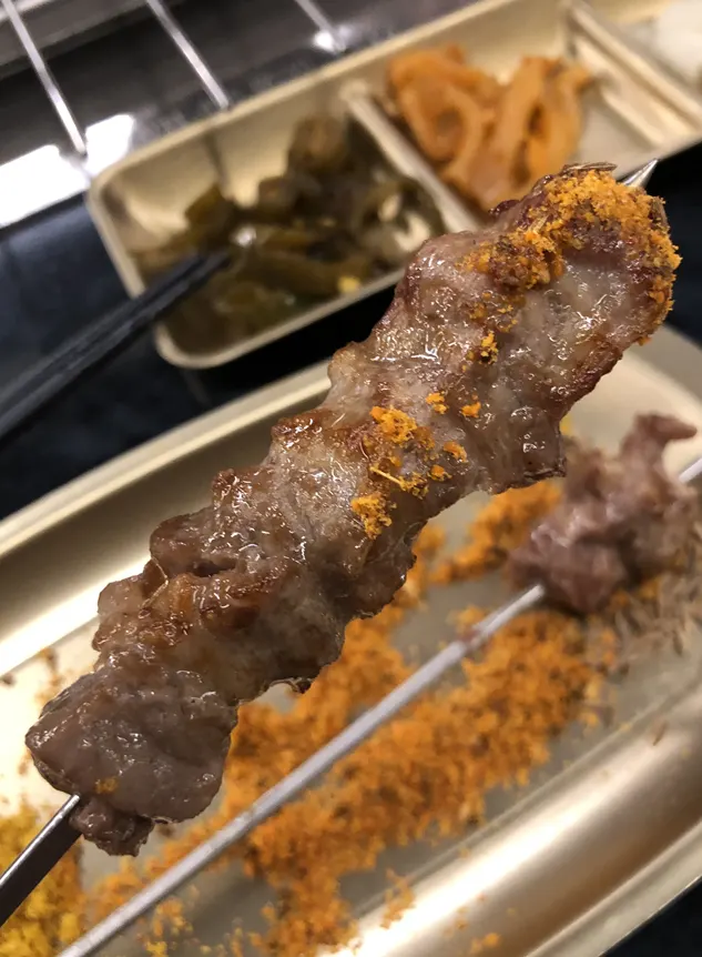 Wangkkochi rotating automatically over charcoal