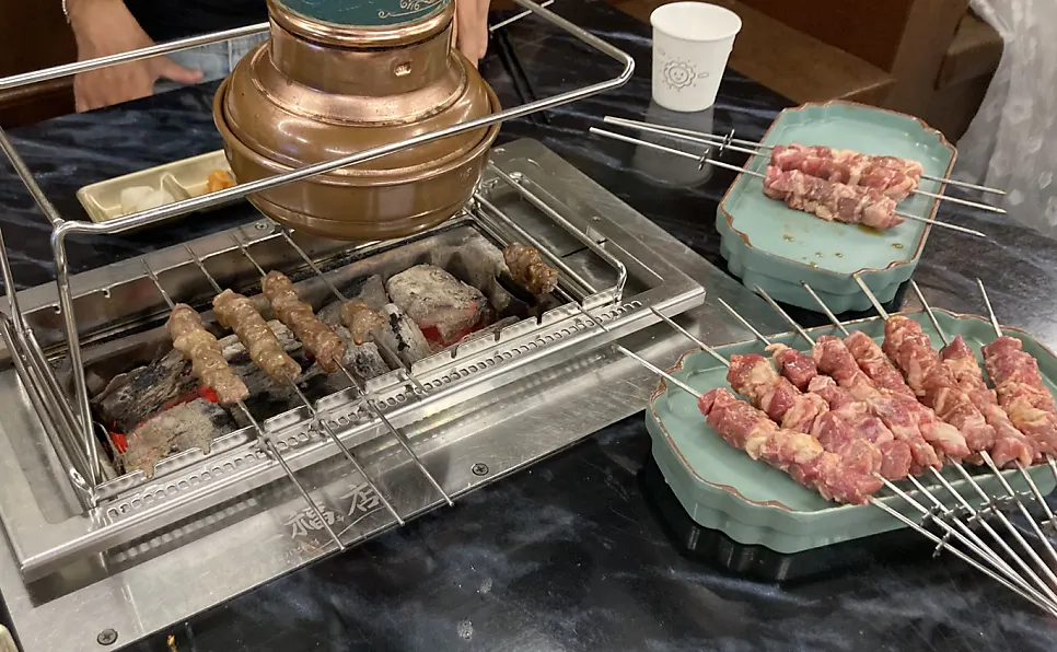 A fresh plate of loin skewers just served