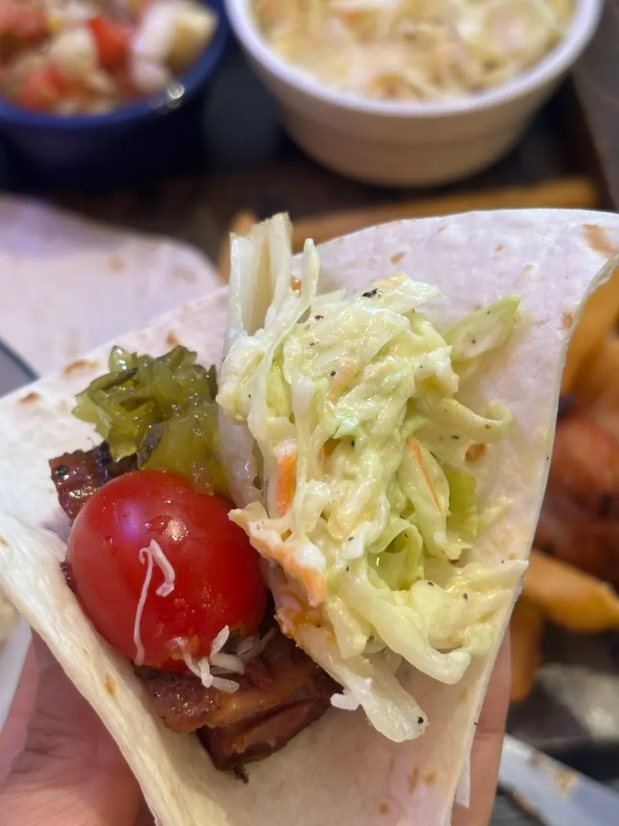 A plate of barbecue served with salad
