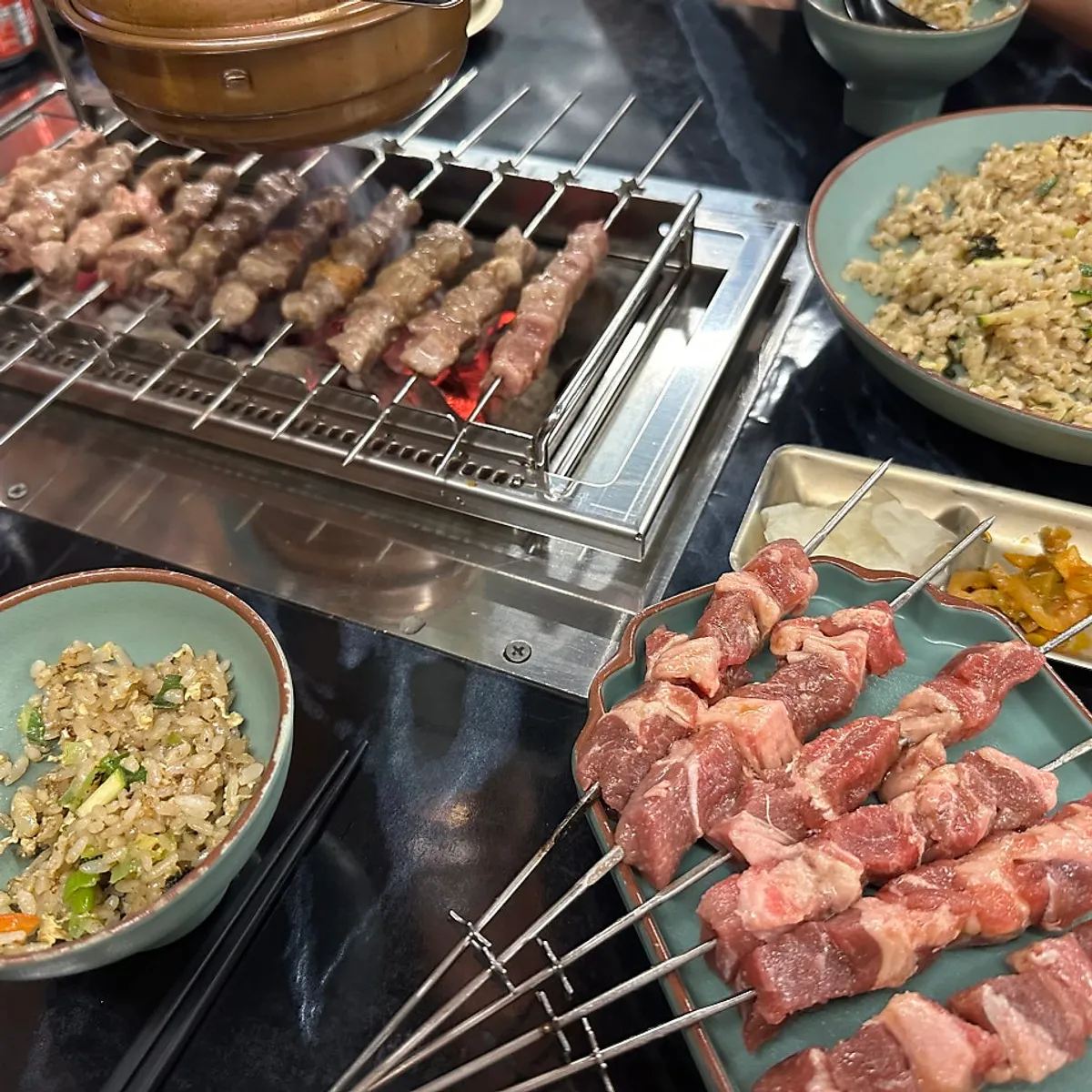 Thick lamb meat about to be dipped into sauce