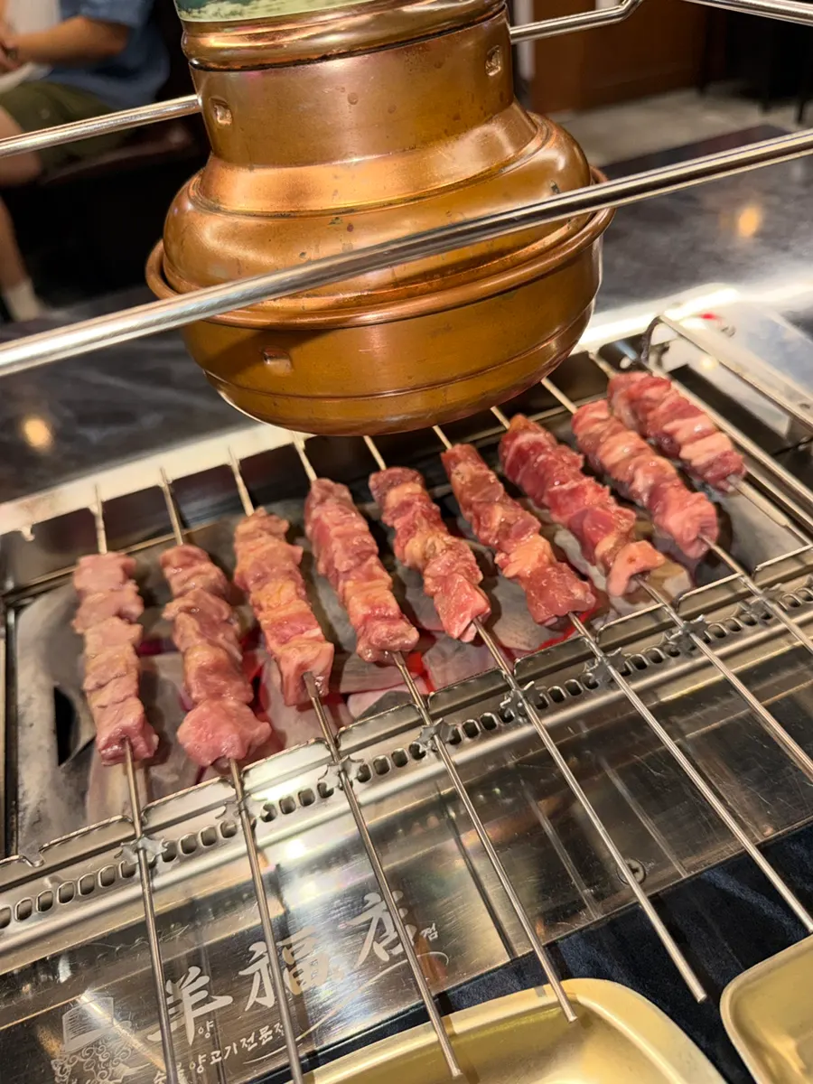 Wangkkochi and wangdeungsim skewers on the charcoal grill