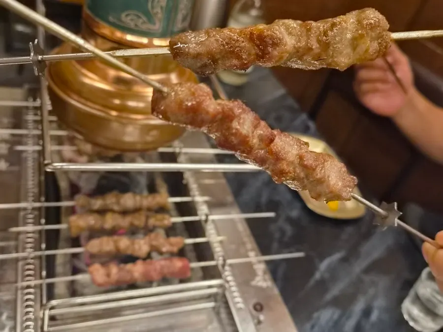 Thick lamb skewers grilled to a golden brown