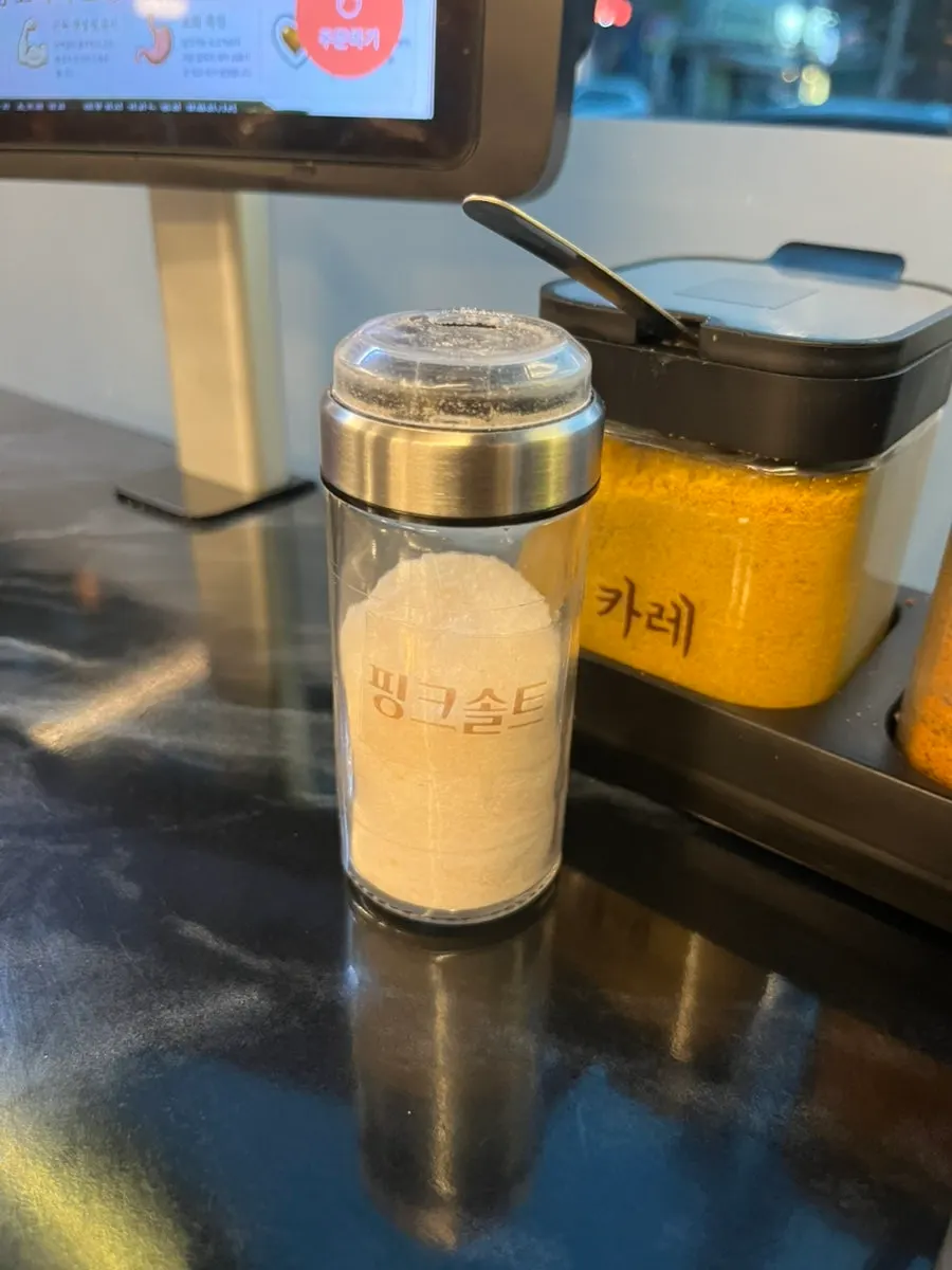 Three sauces and pink salt set on the table