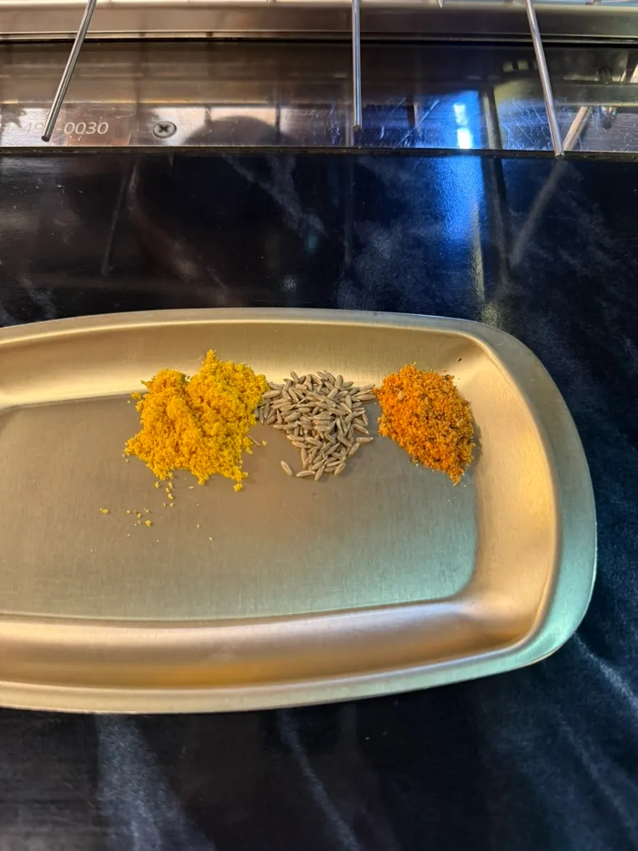 Curry, cumin, and chili powder set up on the side plate