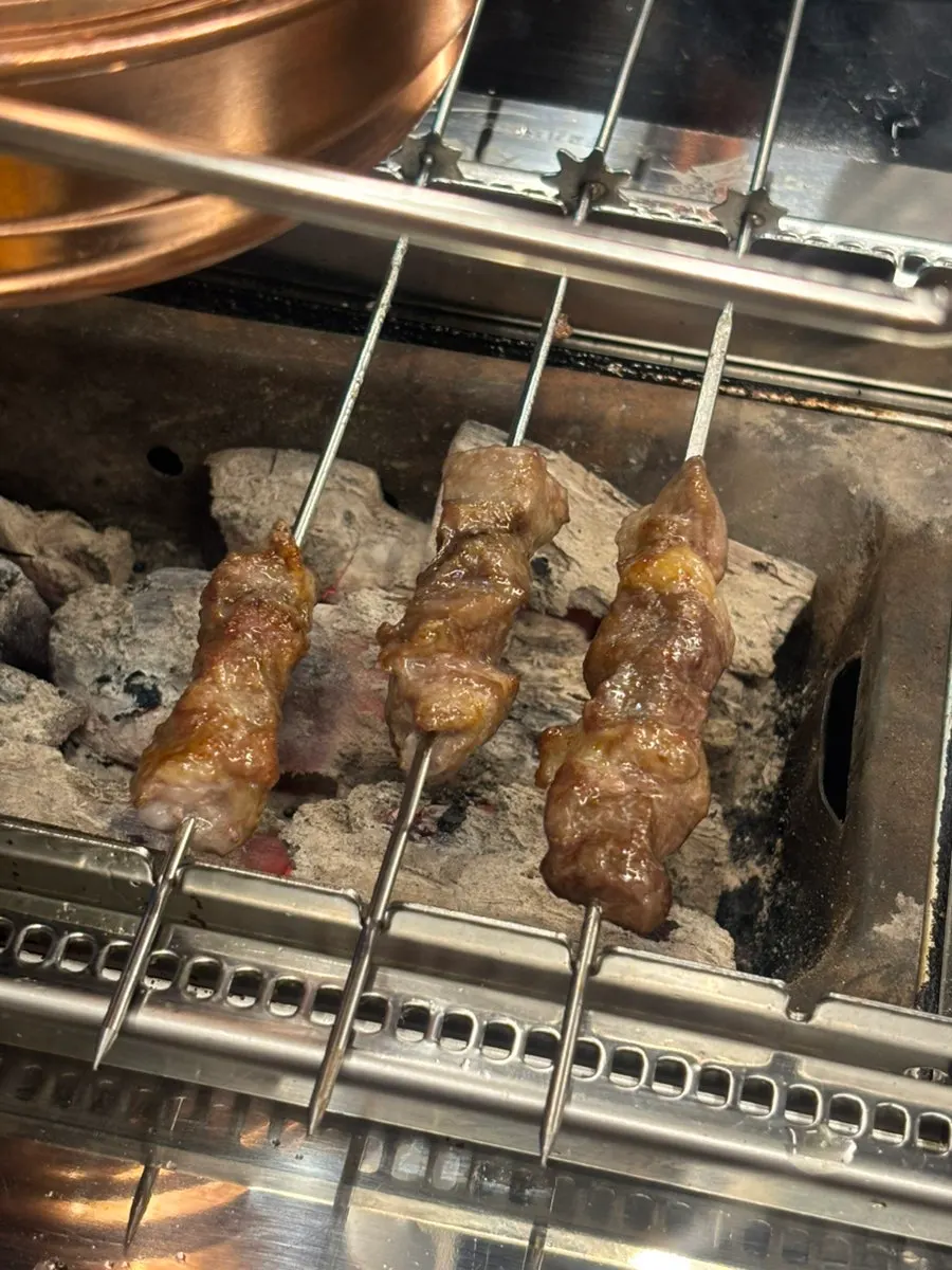 Lamb and sirloin skewers grilling
