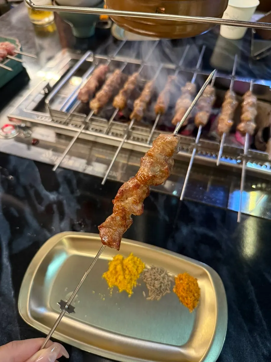 A bite of wang-yangkkochi grilled over charcoal
