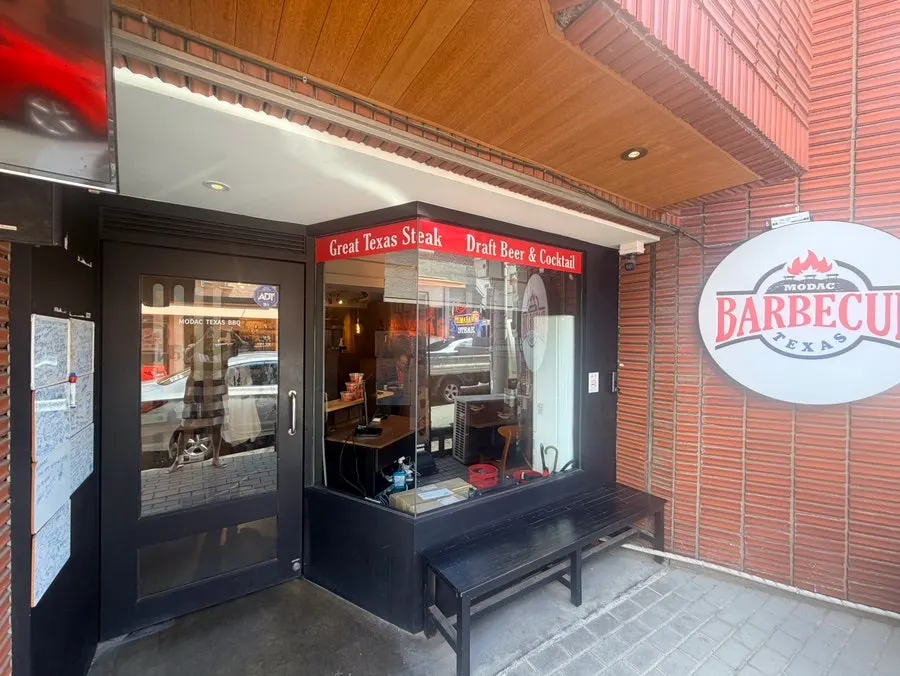 Interior of the American-style barbecue restaurant with wood-tone decor