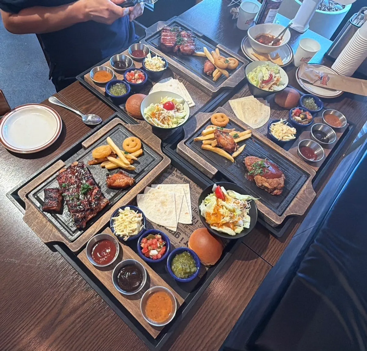 Table laden with the spare rib, whole pork belly, and pulled pork sets