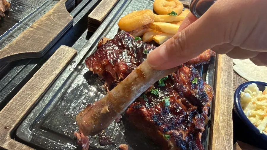 Spare rib meat cleanly separating from the bone