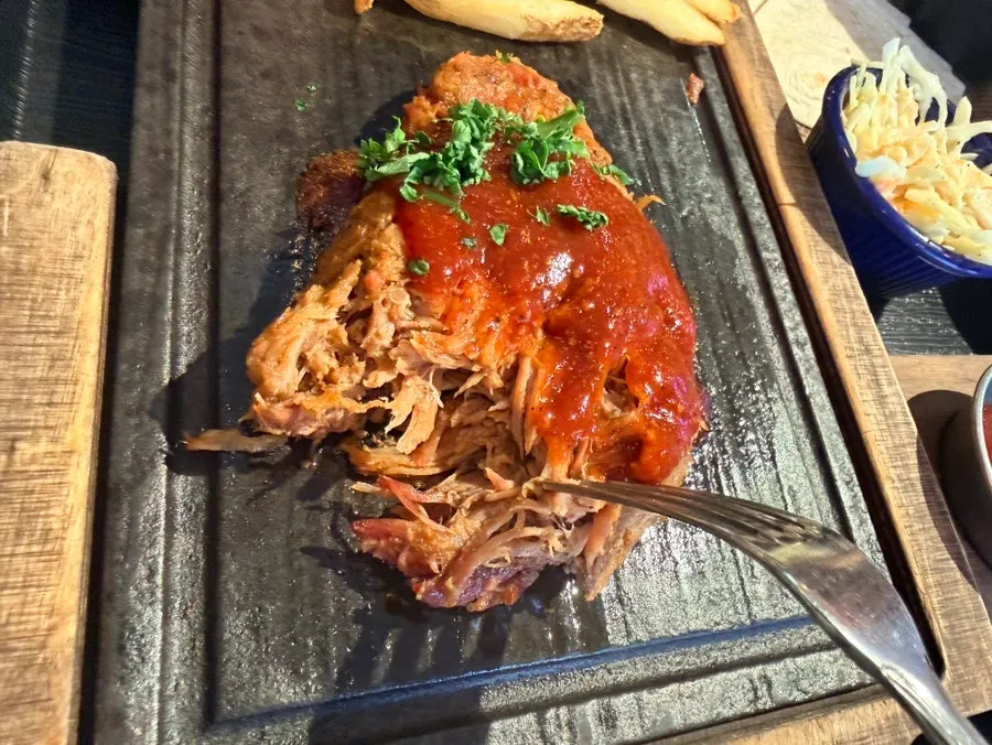 Pulled pork set pulled apart along the grain
