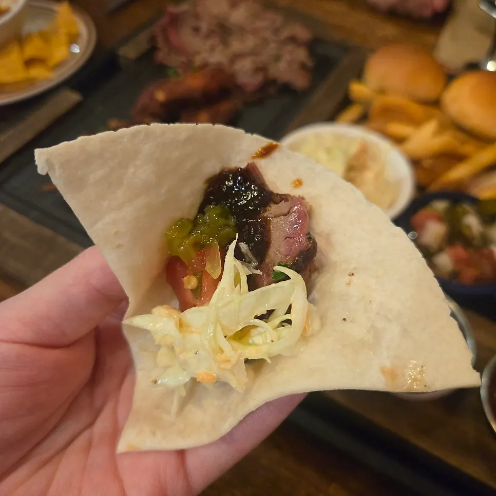 Sliced brisket ready to wrap in a tortilla
