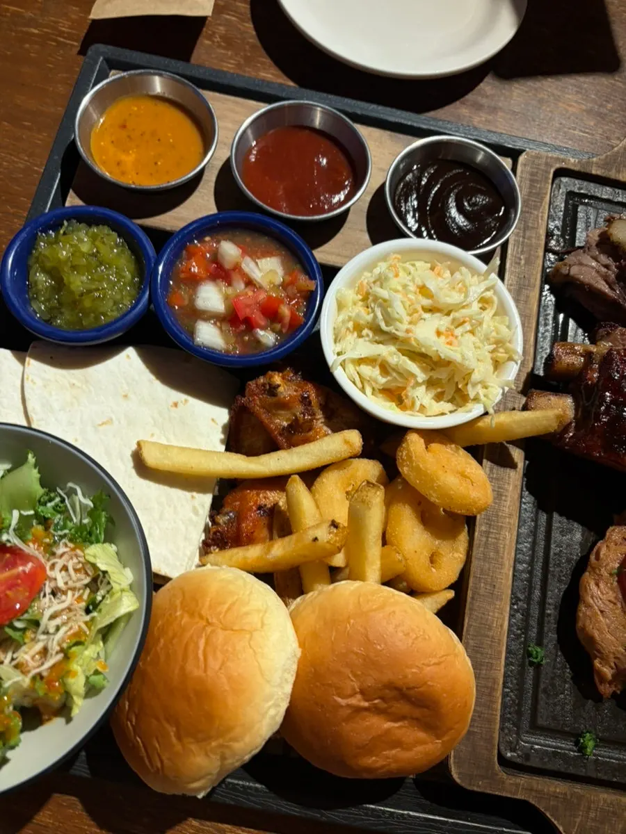 Fries, dinner rolls, and other side dishes