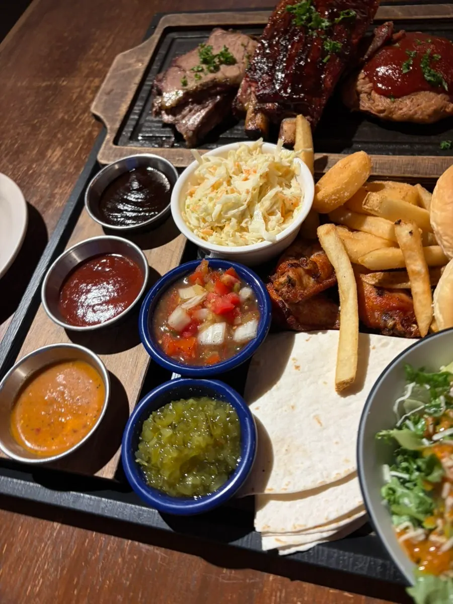 Coleslaw and assorted barbecue sauces