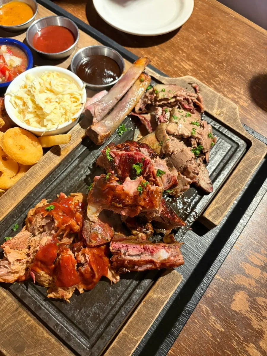 Plate of barbecue meat sliced by staff