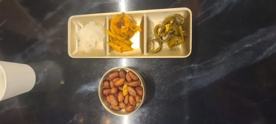 Peanuts and pickled sides for lamb skewers