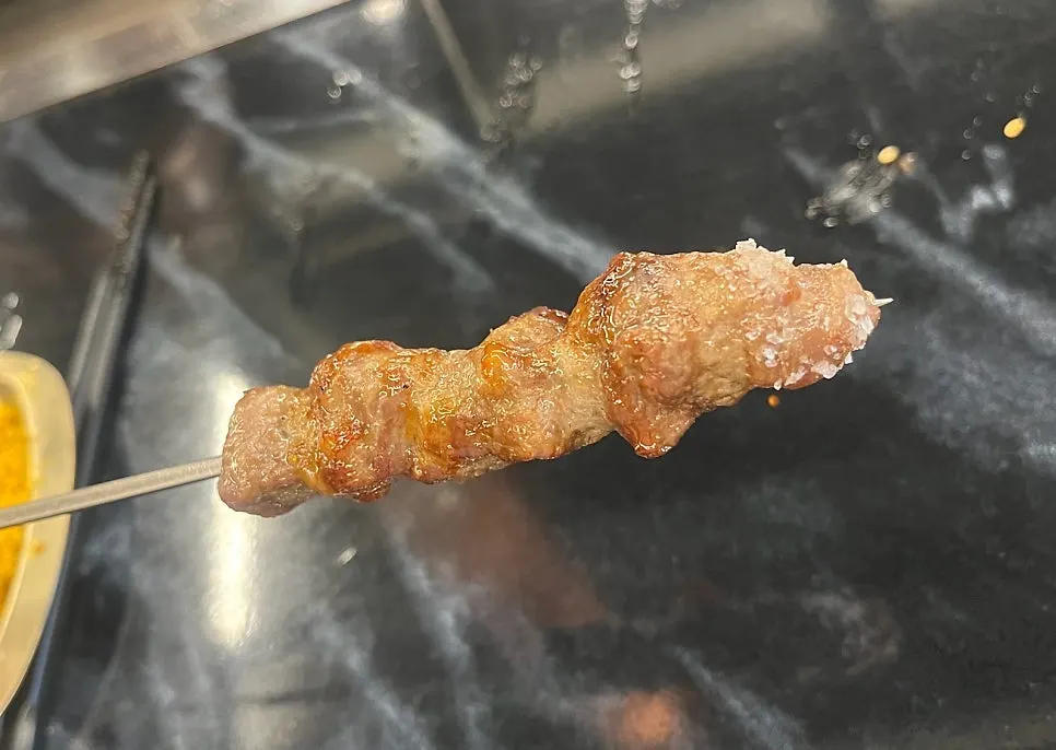 Lamb skewer dipped in salt