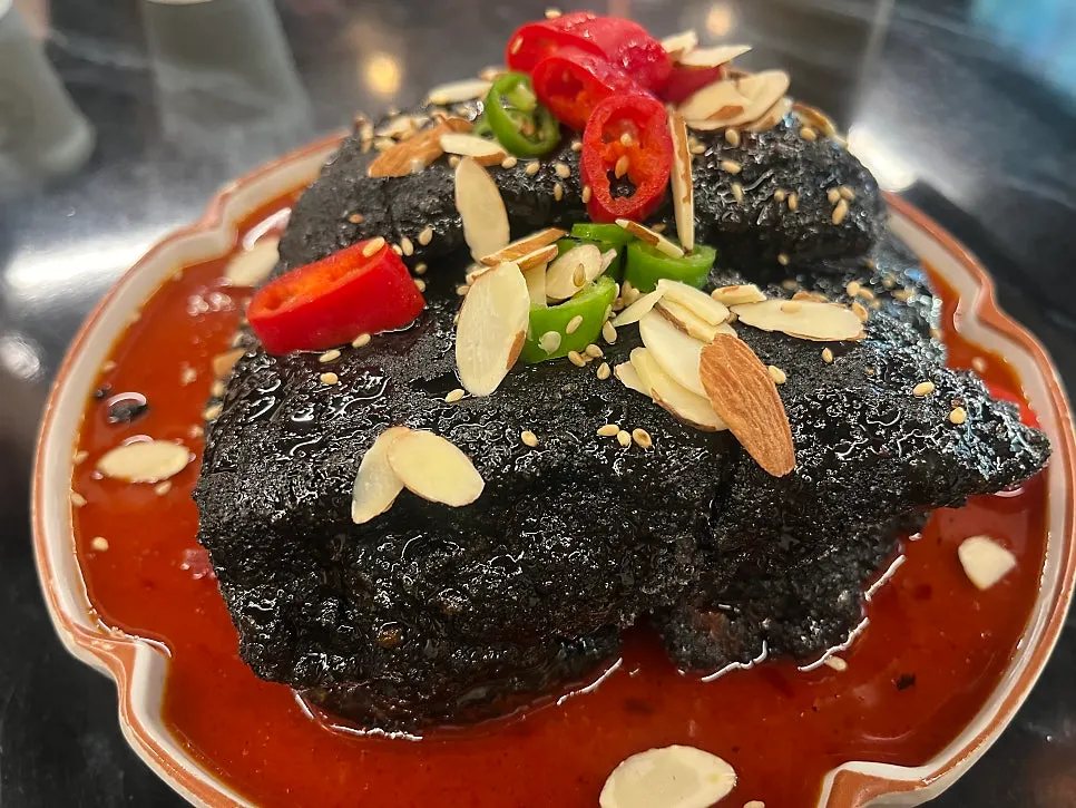 A plate of black quabaorou ordered as a side dish