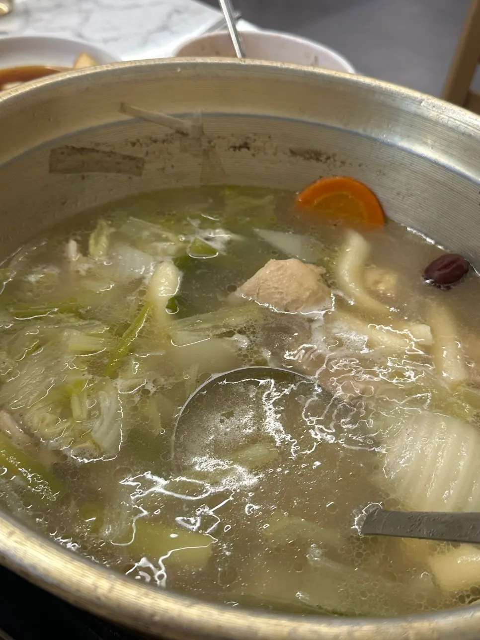 Kalguksu noodles simmered in rich chicken broth