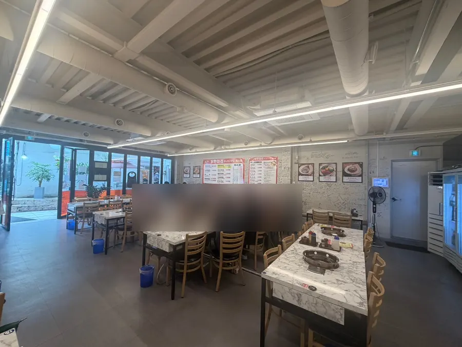 Interior of Sunhuine Bindaetteok with widely spaced tables