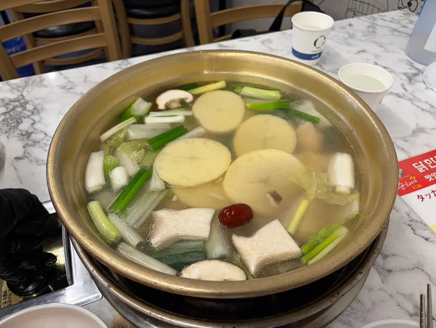 Dak hanmari dipping sauce made with grated garlic, mustard, and chili paste
