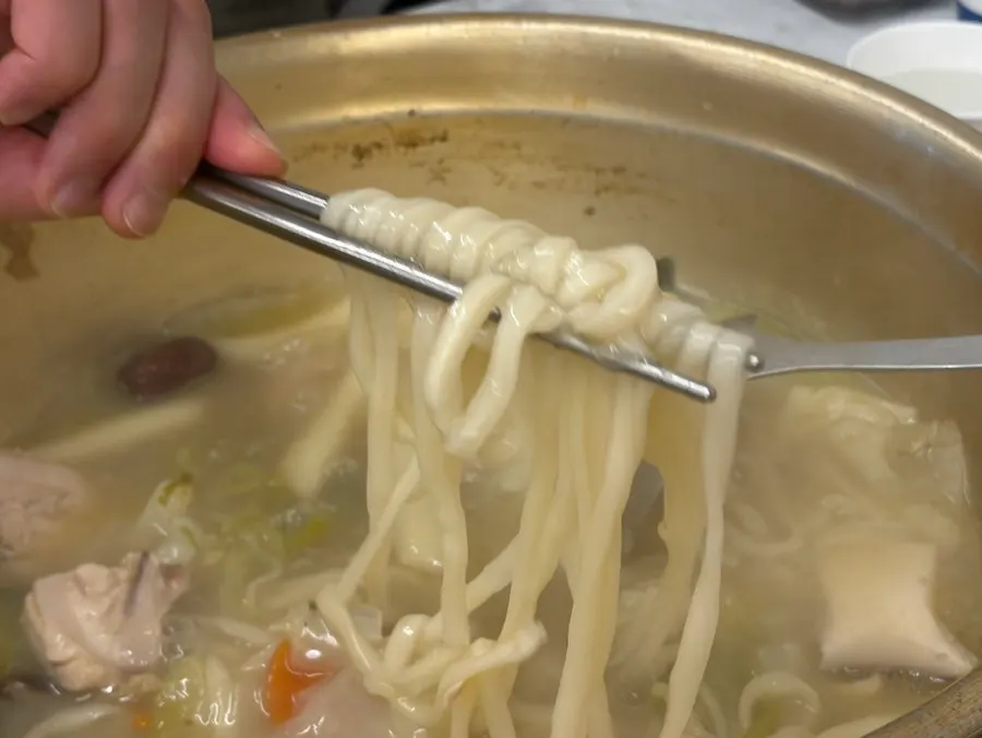 Knife-cut noodles added into the deeply reduced broth