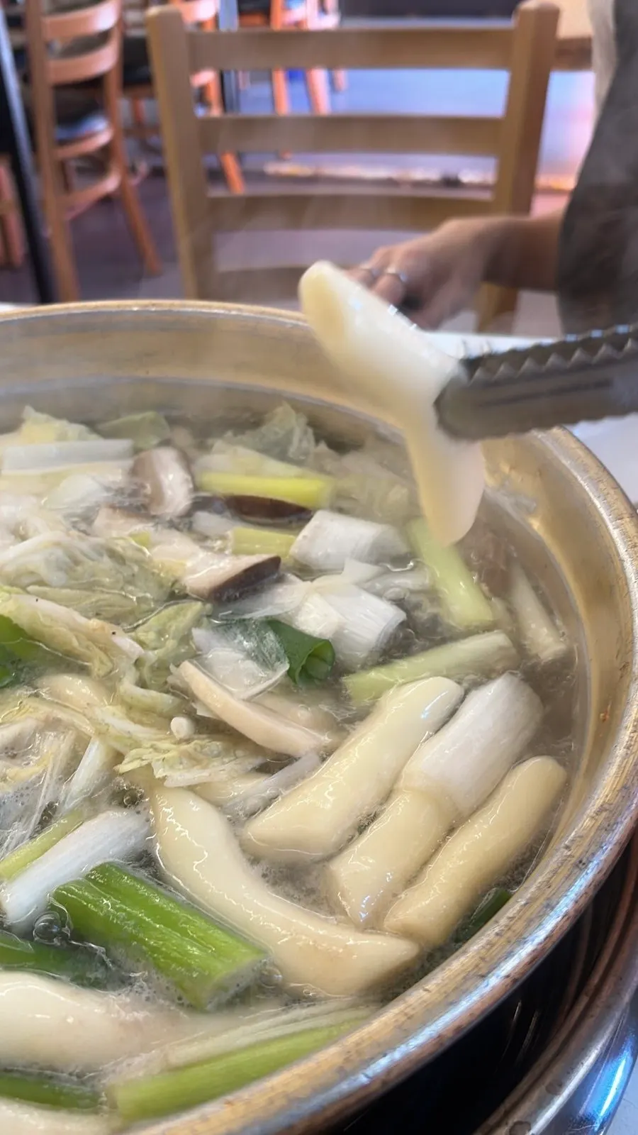 Rice cakes and potatoes cooked soft in the broth