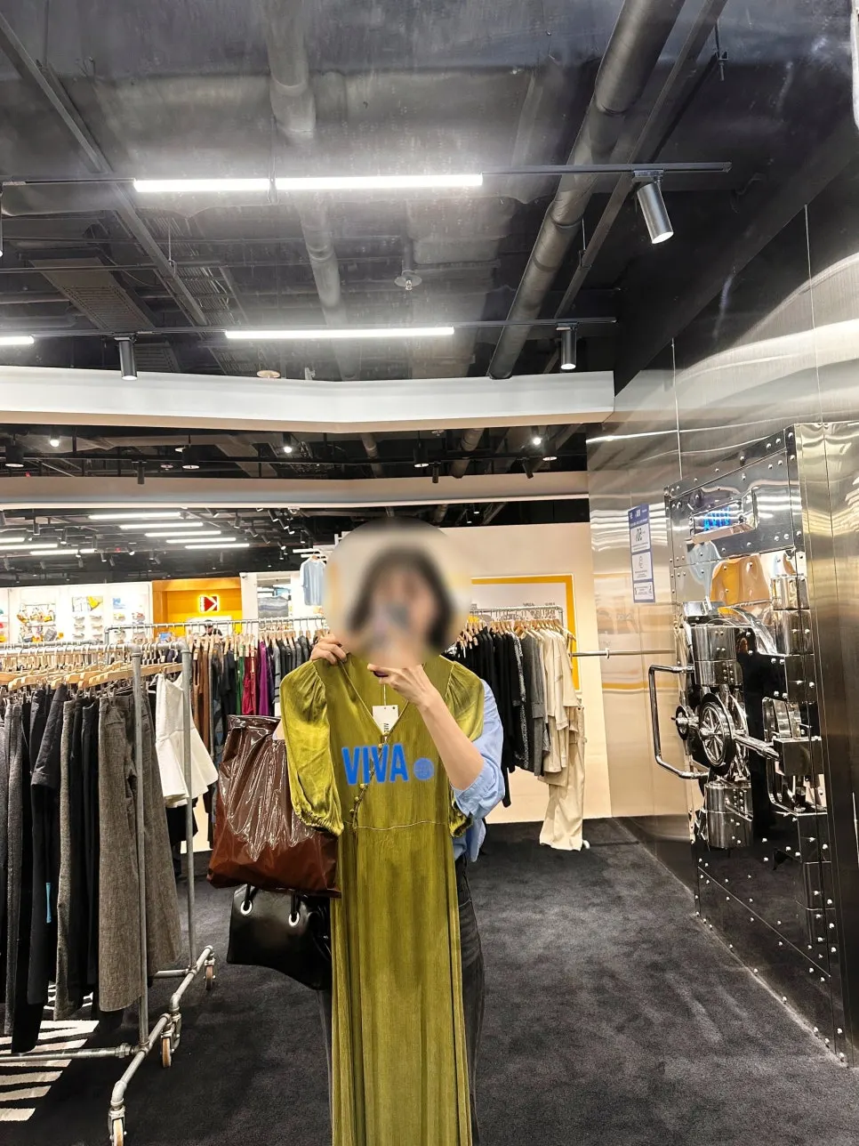 Trying on a vintage dress that caught her eye