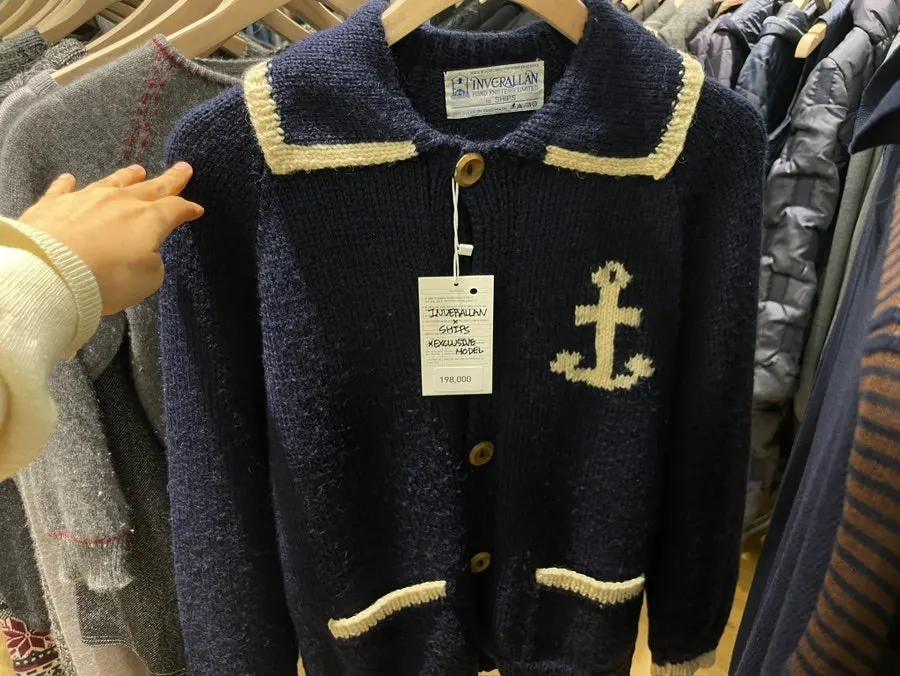 Vintage shirts and collared tees hanging in the Polo zone