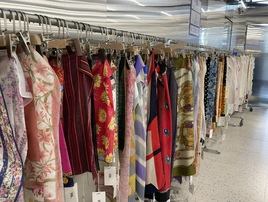 Vintage dresses and shirts on display
