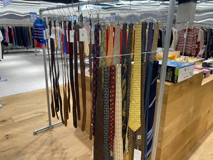Denim pants and jackets organized on a table