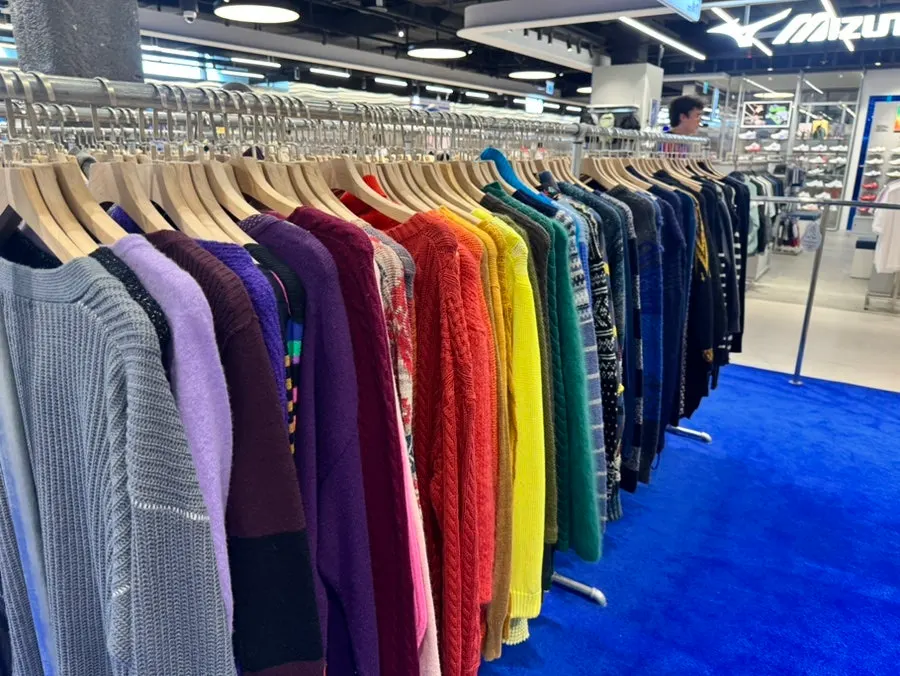 Store aisle packed with vintage clothing
