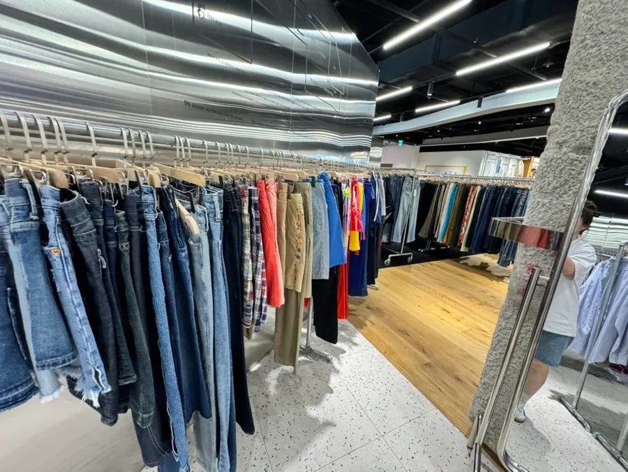 Rack of fall and winter knits and jeans