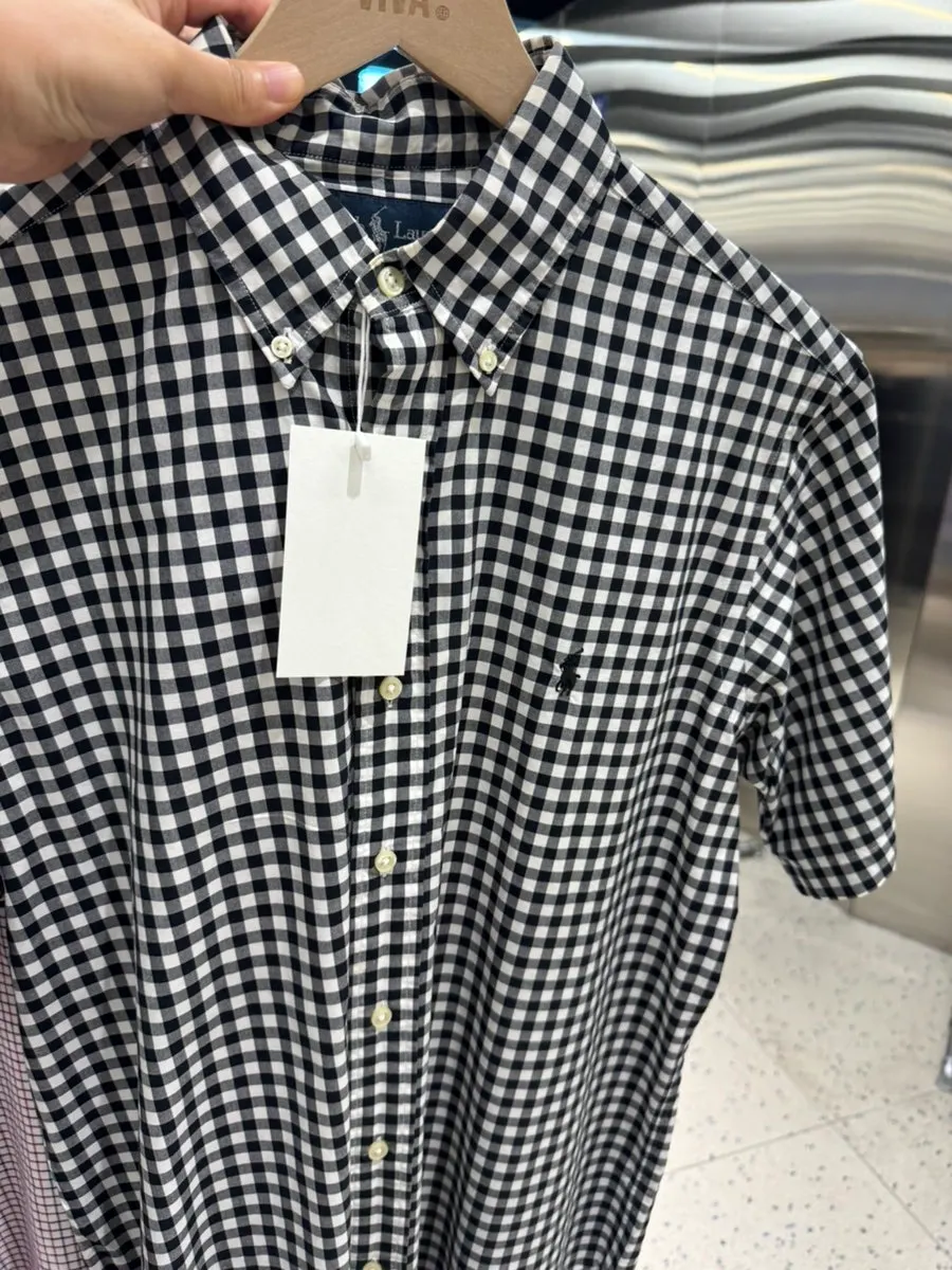 Organized section of Tommy vintage clothing